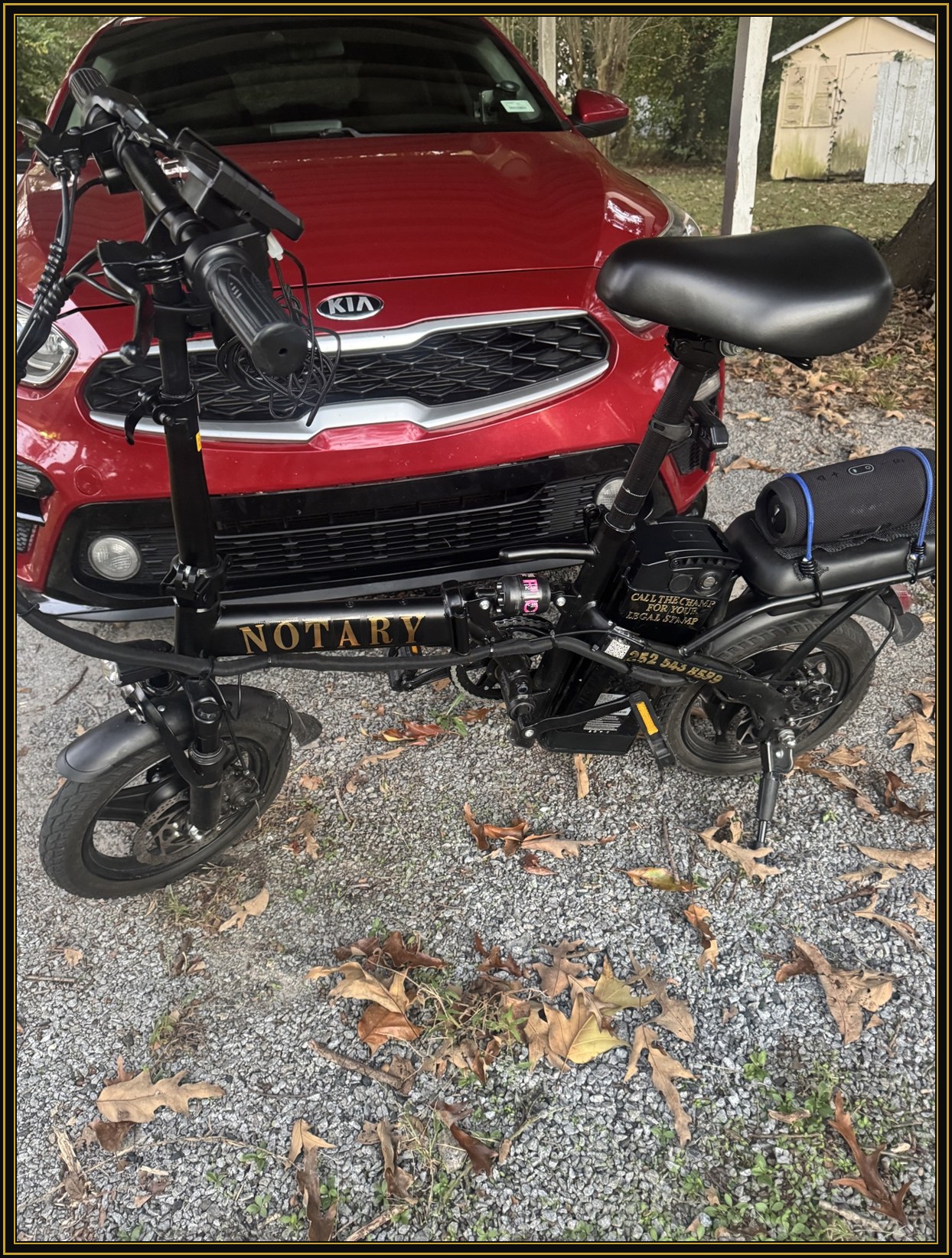 The Champ's famous branded e-bike — when you see the gold, you know the stamp is near.